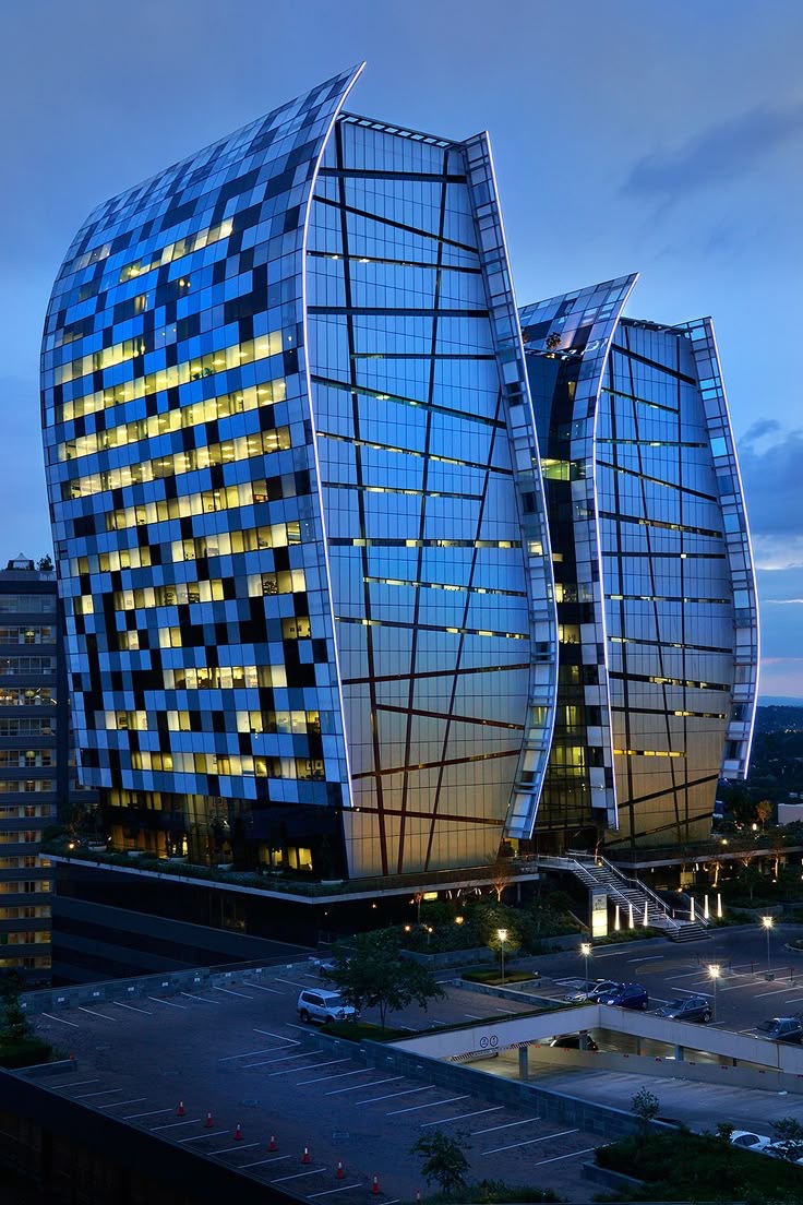 Curved office buildings at dusk